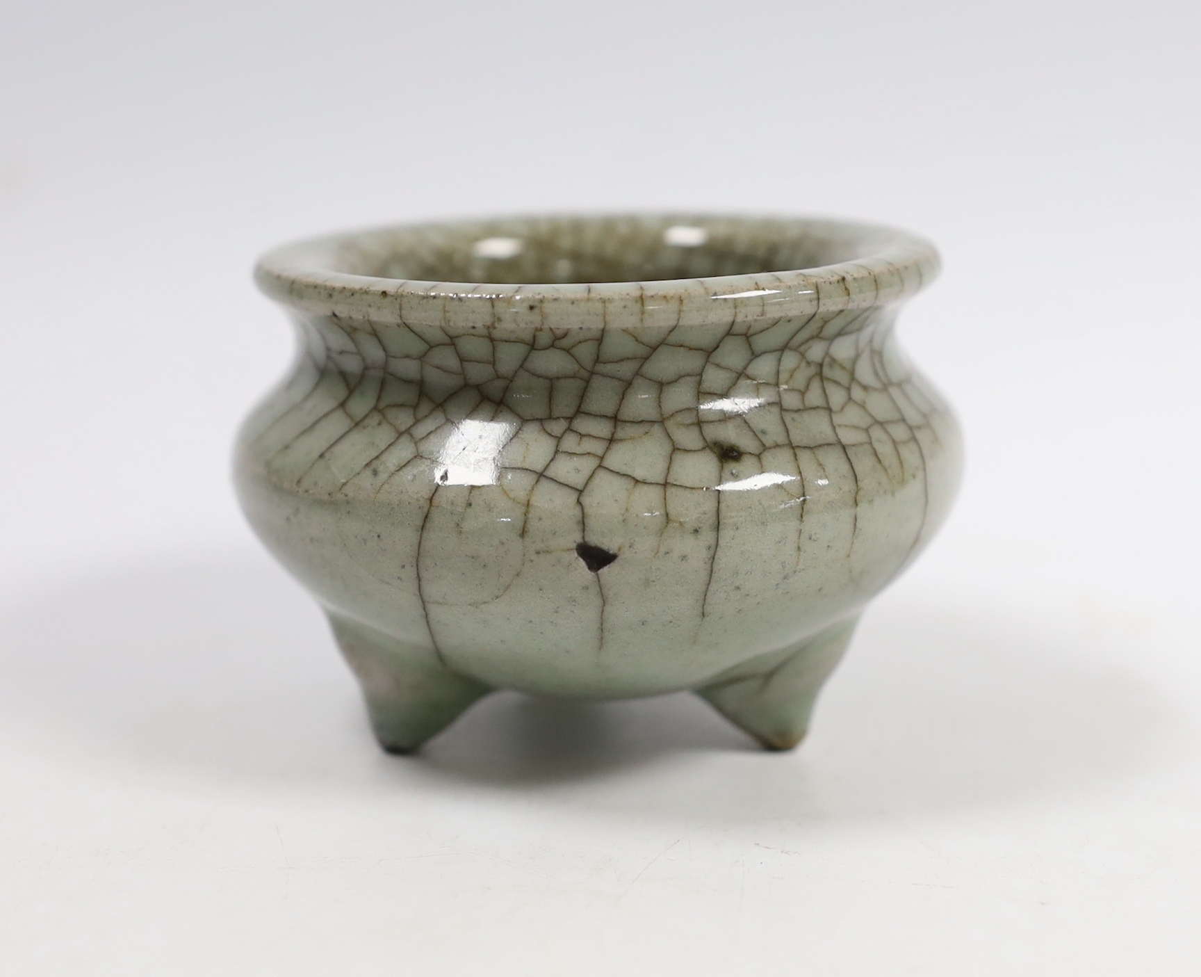 A Chinese Guan type tripod censer, possibly Ming dynasty, 8cm diameter